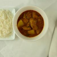 Chicken Vindaloo · White chicken cooked in little tangy and piquant gravy with potatoes.