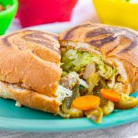 #11. Torta · Daily bake bread, choice of meat, beans, sour cream, guacamole lettuce and cheese.