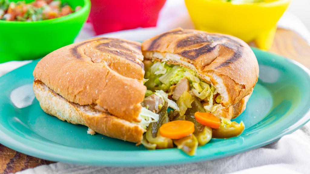 #11. Torta · Daily bake bread, choice of meat, beans, sour cream, guacamole lettuce and cheese.