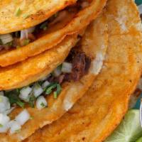 #3. Super Taco · Corn tortilla, choice of meat, lettuce, guacamole, sour cream, cheese, cilantro, onion and s...