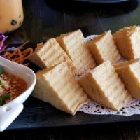 Fried Tofu · Deep fried tofu served with crushed peanut in the sauce.