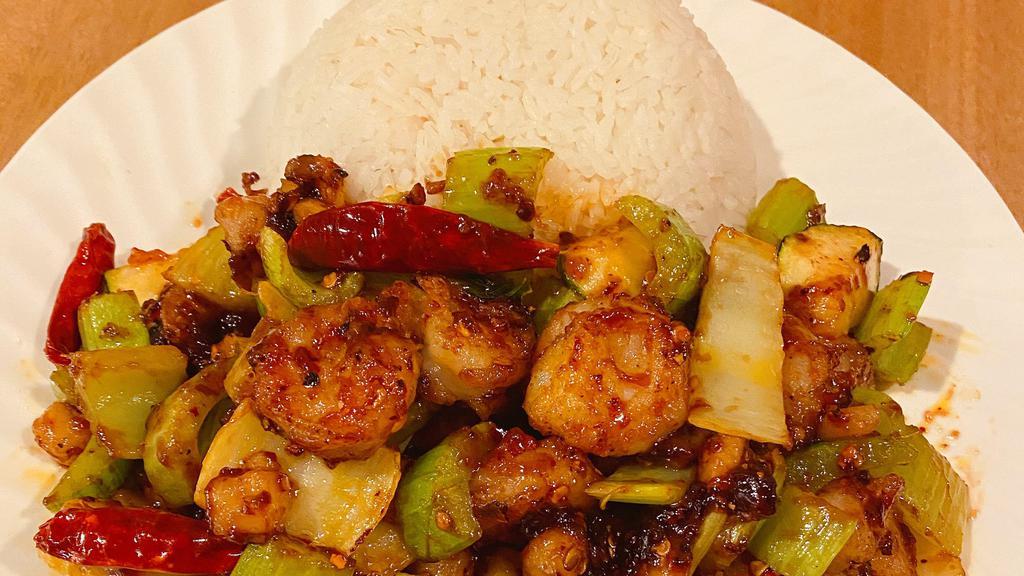 Kung Pao Shrimp · Spicy. Jumbo shrimp, diced carrot, diced celery, diced bamboo shoot in brown sauce and peanut on the top.