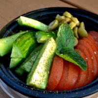 Veggie Bowl · A small plate of cucumbers, tomatoes, olives and mint. Topped with zaatar and extra virgin o...