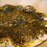 Zaatar Flatbread · The most traditional of our flatbreads. Zaatar is a blend of thyme, sesame seeds, sumac, and...