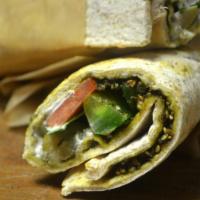 Zaatar Wrap · Zataar (thyme, sesame seeds, olive oil, and sumac) spread across a wrap with cucumbers, toma...