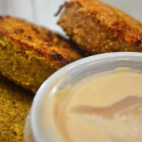 Single Falafel · A single piece of our baked falafel served with a side of tahini sauce.