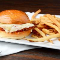 Fried Chicken Sandwich · Fried chicken breast topped with house-made coleslaw and pickles, served on a Hawaiian bun w...