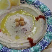 Hummus Bowl · Bowl of homemade Lebanese hummus with pita bread on the side.