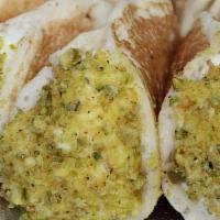 Atayef · Middle-Eastern pancake dipped in ground pistachio and filled with ashta (sweet, rich clotted...