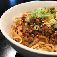 Dan Dan Noodles · Steamed noodles, minced pork, spicy sesame peanut sauce, chili oil, crushed peanuts and scal...
