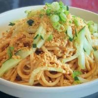 Cold Noodles With Peanut Sauce · Vegetarian. Cold noodles tossed in peanut sauce and topped with cucumbers, scallions and pea...