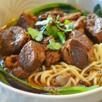 紅燒牛腩麵 Braised Beef Stew Noodle Soup · Slow-cooked beef, bok choy, egg noodles.