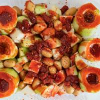 Pepinos Locos · cucumbers  dug out and filled with Japanese peanuts tamarindo candy jicama  chamoy tajin and...