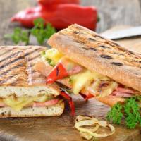 Soujouk Pressed Panini · Fresh Panini made with Armenian Beef, lettuce, tomato, garlic sauce and pickles.