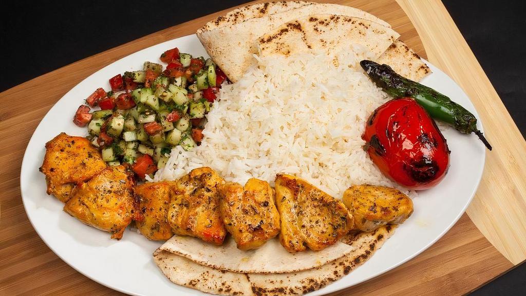 #11 Chicken Kabob Boneless · Juicy Chicken Pieces - Served with Rice, Pita Bread, Shirazi Salad, Grilled Tomatoes and Peppers