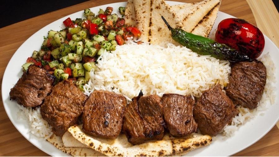 #13 Beef Shish Kabob · Tender Beef Sirloin served with Rice, Pita Bread, Shirazi Salad, Grilled Tomatoes and Peppers