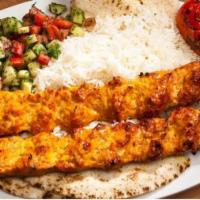 #12B Persian Koubideh Chicken · Two Skewers of Ground Chicken perfectly seasoned served with Rice, Pita Bread, Shirazi Salad...