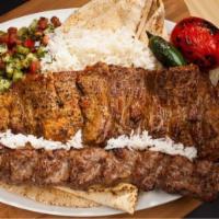 #22 Soltani Combo Chelo & Lula · One Skewer Beef Filet and One Skewer of Ground Sirloin Beef served with Rice, Pita Bread, Sh...