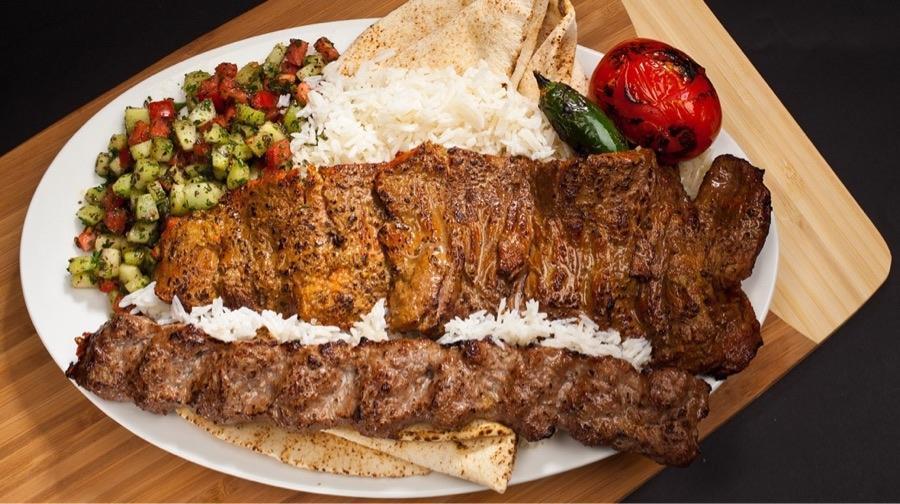#22 Soltani Combo Chelo & Lula · One Skewer Beef Filet and One Skewer of Ground Sirloin Beef served with Rice, Pita Bread, Shirazi Salad, Grilled Tomatoes and Peppers