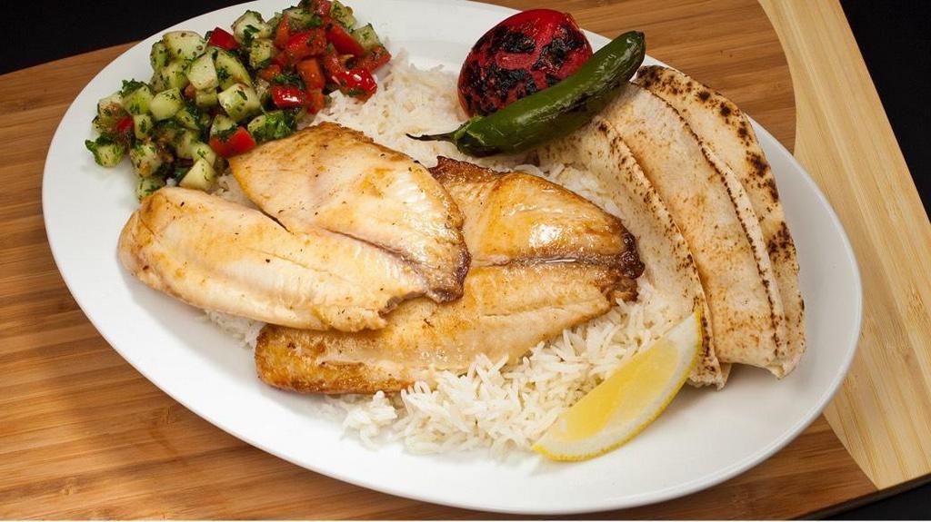 #17A Tilapia · Boneless skinless tilapia fish served with Rice, Pita Bread, Shirazi Salad, Grilled Tomatoes and Peppers