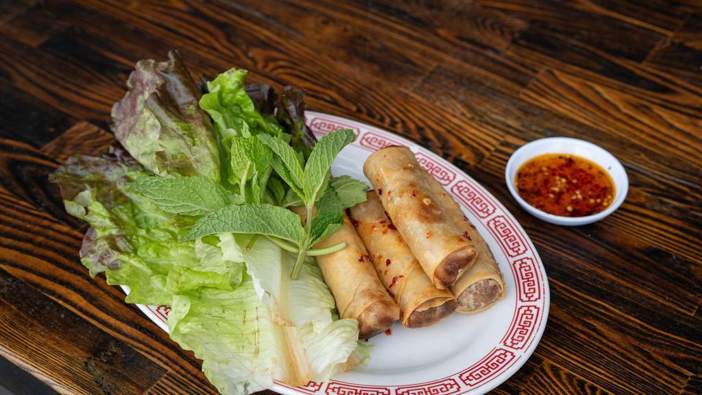 Spring Rolls · Crispy veggie spring rolls filled with cabbage, green beans, vermicelli and tofu bean curd. Served with sweet chili sauce.