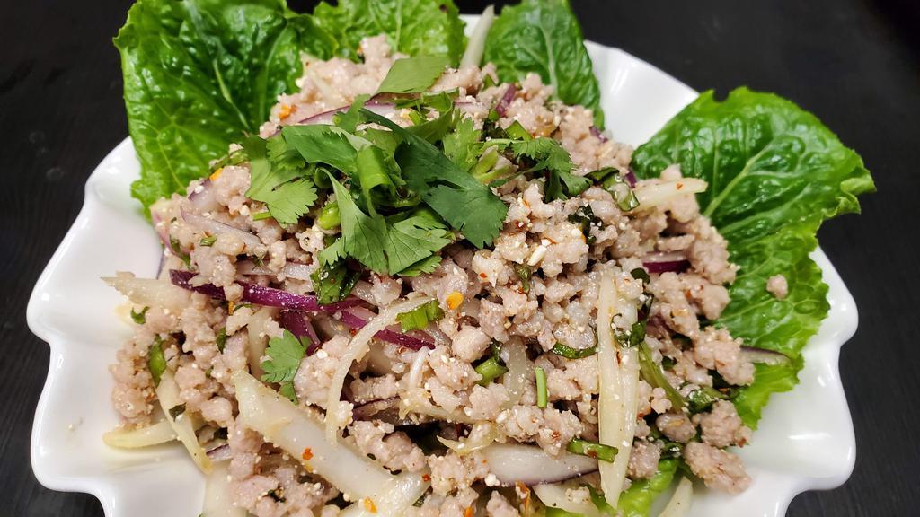 Larb (Ground Meat Salad) · Ground meat (choice of chicken, pork, or beef) with chili peppers, onion, lime juice, ground rice, and served with lettuce. Spicy!