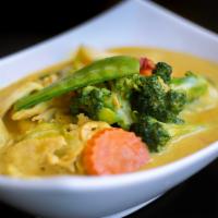 Yellow Curry · Yellow curry paste with onion, sweet potato, carrots, and coconut milk.