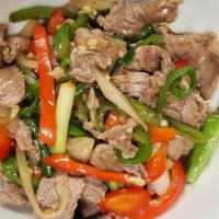 Spicy Pepper Beef · Stir-fried beef with three kinds of peppers, onion, scallion, garlic, and sauce. Comes with ...
