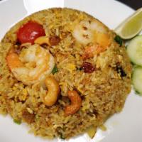 Pineapple Fried Rice · Fried rice with pineapple, shrimp, chicken, scallion, cashew nut, raisin, tomato, and curry ...