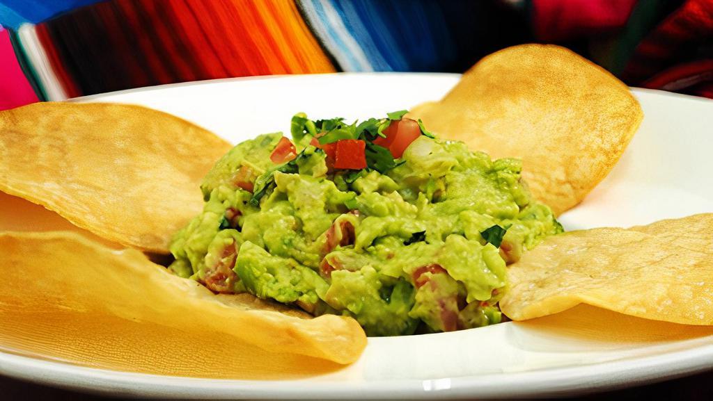 Guacamole & Chips · Freshly made guacamole, crafted from avocado, tomatoes, cilantro, onions, lime juice, salt and pepper. Get the party started with this classic dip.