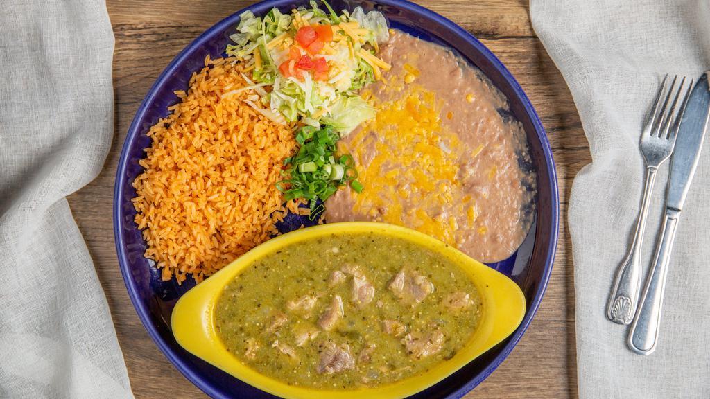 Chile Verde · Slow simmered pork, mild tomatillo, sauce, green peppers, onions, spices with rice and bean.