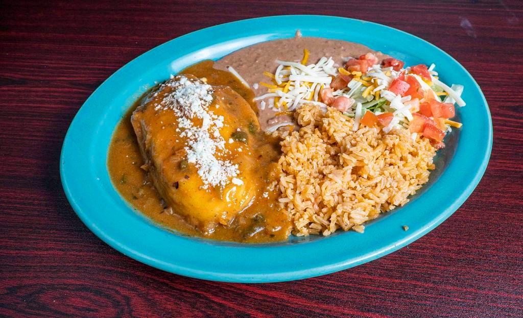 Chile Relleno Plate · Battered and fried poblano, chile stuffed with Jack cheese, topped with homemade parlano sauce, refried beans, Mexican rice, cotija cheese.