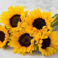 Sunflowers  · 5 stems of seasonal sunflowers wrapped in clear cellophane.