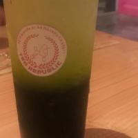 Green Thai Tea · Stronger flavor Thai Tea Top with Half and Half.