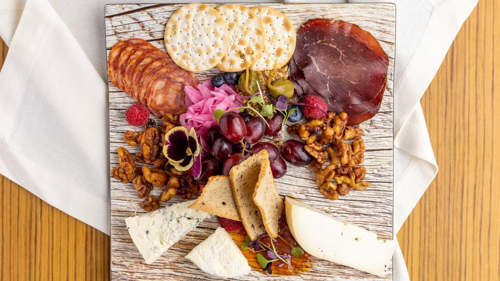 Cheese & Charcuterie · Chef's selection of charcuterie and cheeses from all over the world, served with crostini, mustard, pickled red onions, caper berries, jam of the day