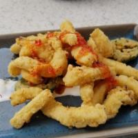 Crispy Calamari · Blistered shishito peppers, lemongrass dipping sauce, fresno chili glaze.