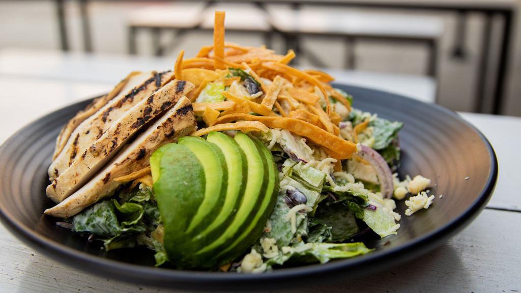 Sante Fe Chicken Salad · Black beans, corn, crispy flour tortilla, peppers, onions, red cabbage, jicama, avocado, pepperjack cheese, chipotle ranch dressing.