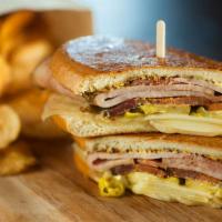 Cubano · Black forest ham, thick cut bacon, pickles, pepperoncini, whole grain mustard, gruyère chees...