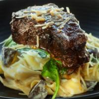 Beef Shortrib Strogi · Fresh pappardelle pasta, roasted mushrooms, bloomsdale spinach.