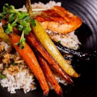 Roasted Salmon · Herb jasmine rice, roasted heirloom carrots, black garlic demi.