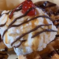 Churro Waffle Sundae · Cinnamon sugar waffles, vanilla ice cream, chocolate ganache caramel sauce, maraschino cherry.