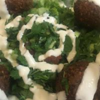 Falafel · Garbanzo   beans, Onion, Parsley ,  Garlic, Cumin, (4 pc)