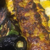 Chicken Soltani · Halal Boneless breast of skewered chicken and lean ground chicken skewer, char-broiled to pe...