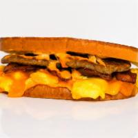 Sourdough, Bacon, Sausage, Egg & Cheddar Sandwich · 2 scrambled eggs, melted Cheddar cheese, smoked bacon, breakfast sausage, and Sriracha aioli...