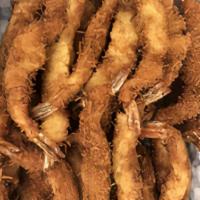 Coconut Shrimp Tempura · Deep-fried shrimp batter served with sweet and sour sauce.