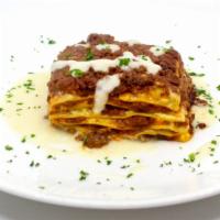 Lasagna Bolognese · House made lasagna, bolognese ragout, bechamel, and Parmigiano cream sauce.