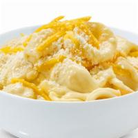 Truffle Mac · Elbow pasta in creamy cheesy alfredo sauce infused with truffle oil.