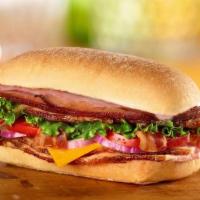 Bbq Smoked Stacker Sandwich · Honey Baked Ham, bacon, cheddar cheese, lettuce, tomato, red onion and smoky BBQ sauce on ci...