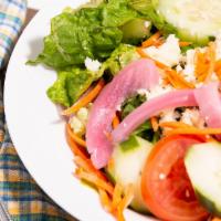 House Salad · Romaine and iceberg lettuce, cucumbers, carrots. Purple cabbage, radishes. Tomatoes, marinat...