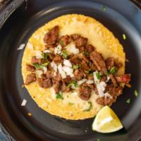 Queso Taco · Handmade tortilla, cheese, protein, and salsa de guacamole.